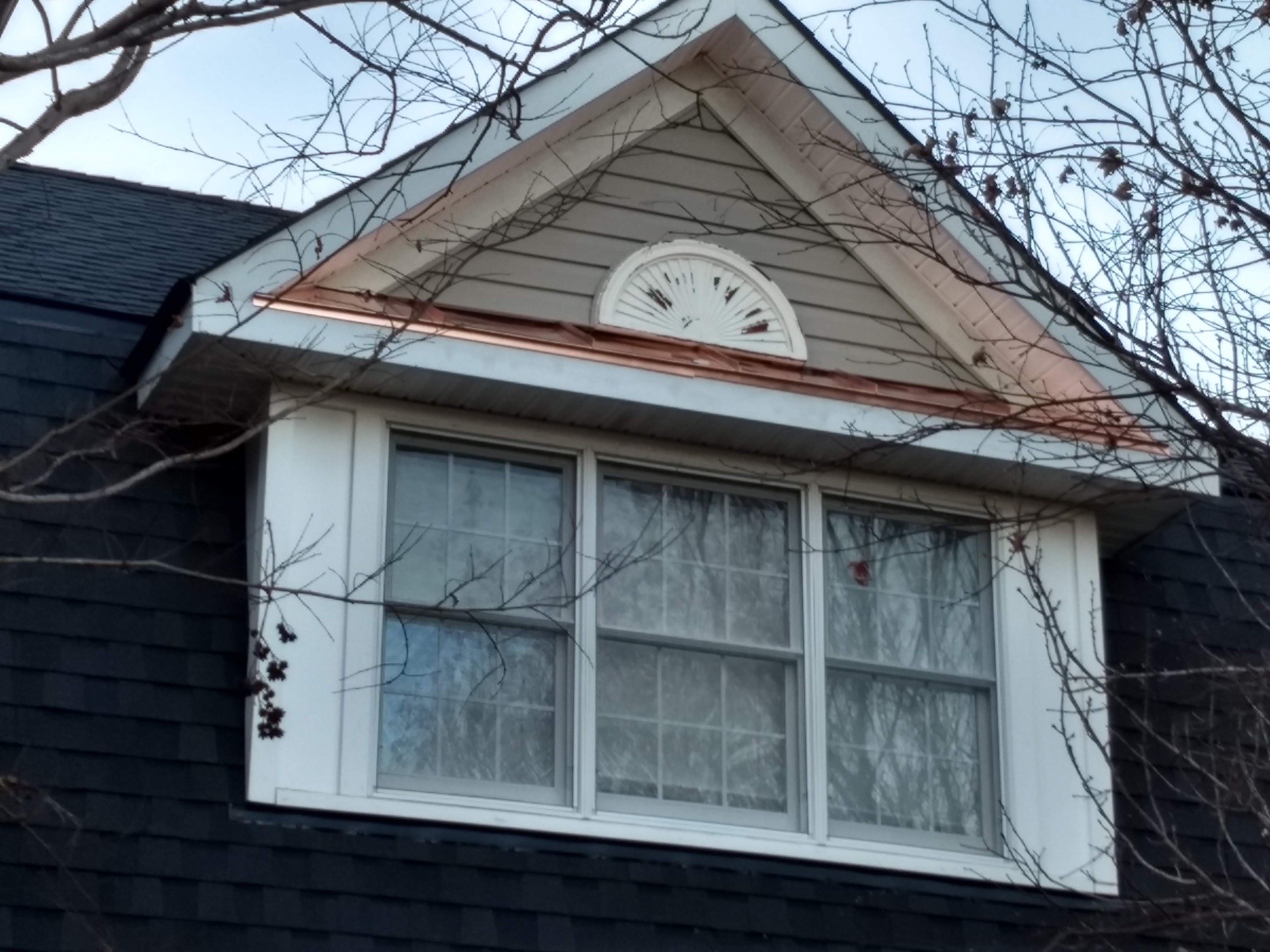 Custom copper flashing and trim on a dormer