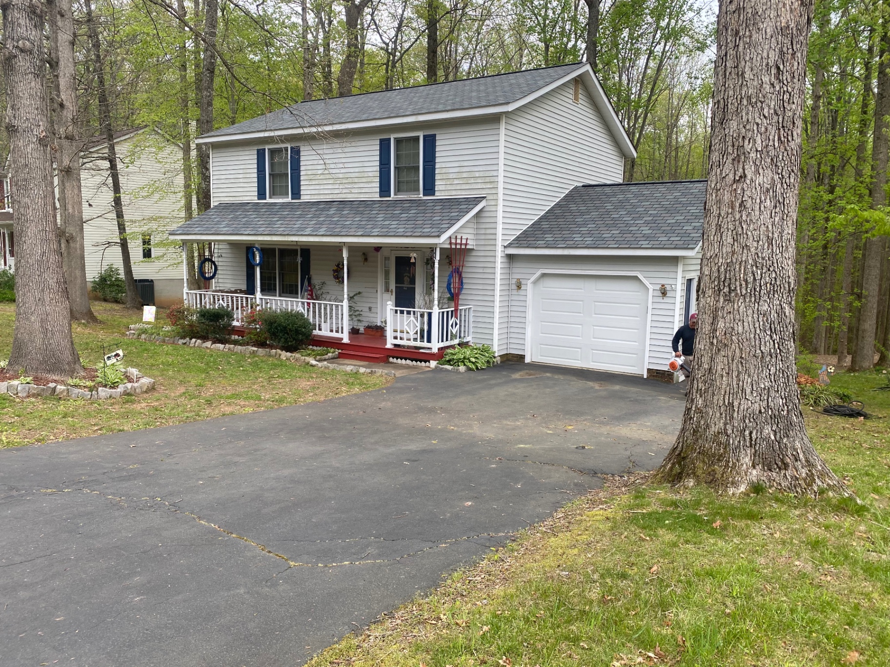 Wide view of a colonial home with a new slate-look shingle roof